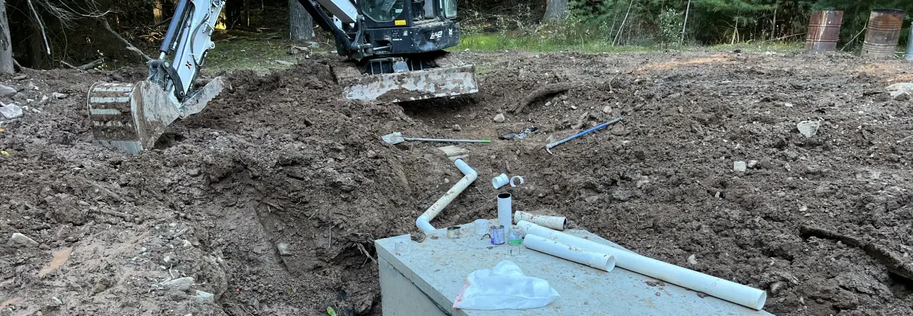 Contractors performing emergency water and sewer line repair for a property in Montgomery NY